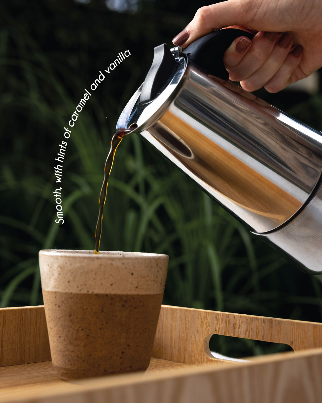 Moka pot pouring Tropicalia coffee into a cup